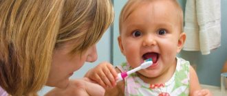 Mom teaches baby to brush teeth