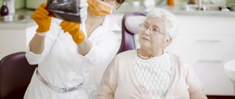 A dentist discusses gum transplant surgery with a patient.